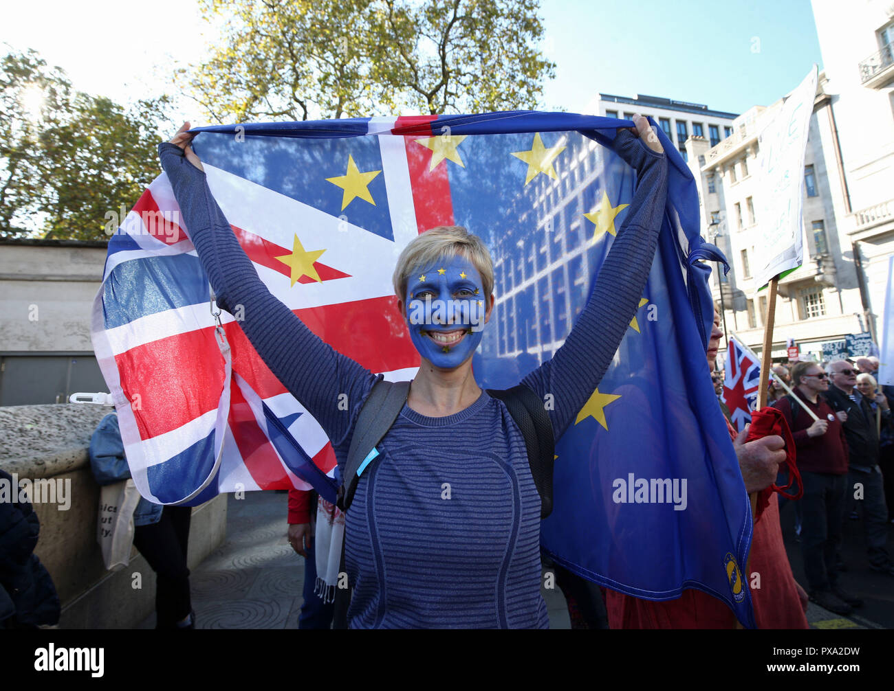 An anti-Brexit campaigner with her face painted in the colours of the European Union flag takes part in the People's Vote March for the Future in London, a march and rally in support of a second EU referendum. Stock Photo