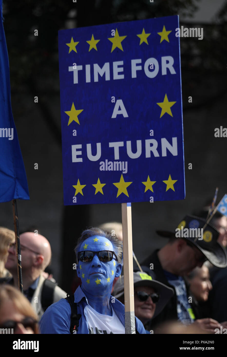 An anti-Brexit campaigner with his face painted in the colours of the European Union flag takes part in the People's Vote March for the Future in London, a march and rally in support of a second EU referendum. Stock Photo