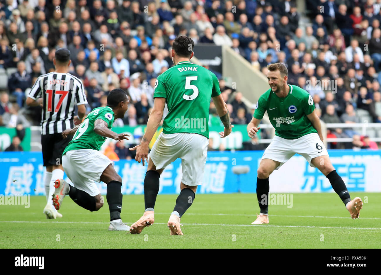 Brighton & Hove Albion's Jose Izquierdo, Dale Stephens and Lewis Dunk celebrate Beram Kayal's first goal of the game during the Premier League match at St James' Park, Newcastle. Stock Photo