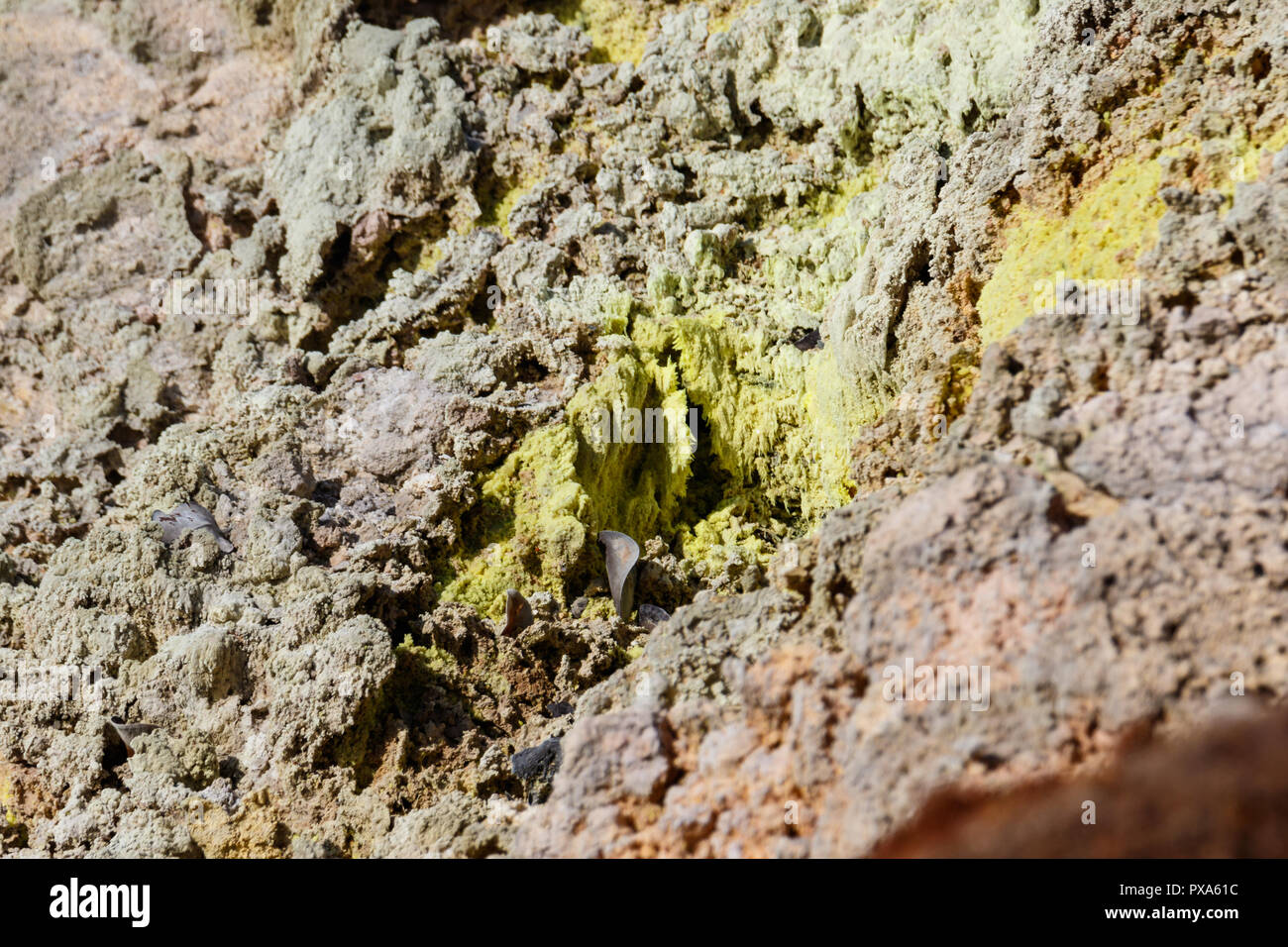 Sulfur mineral deposit, with visible crystals, at a volcanic gas vent. In Volcano National Park, Hawaii. Stock Photo