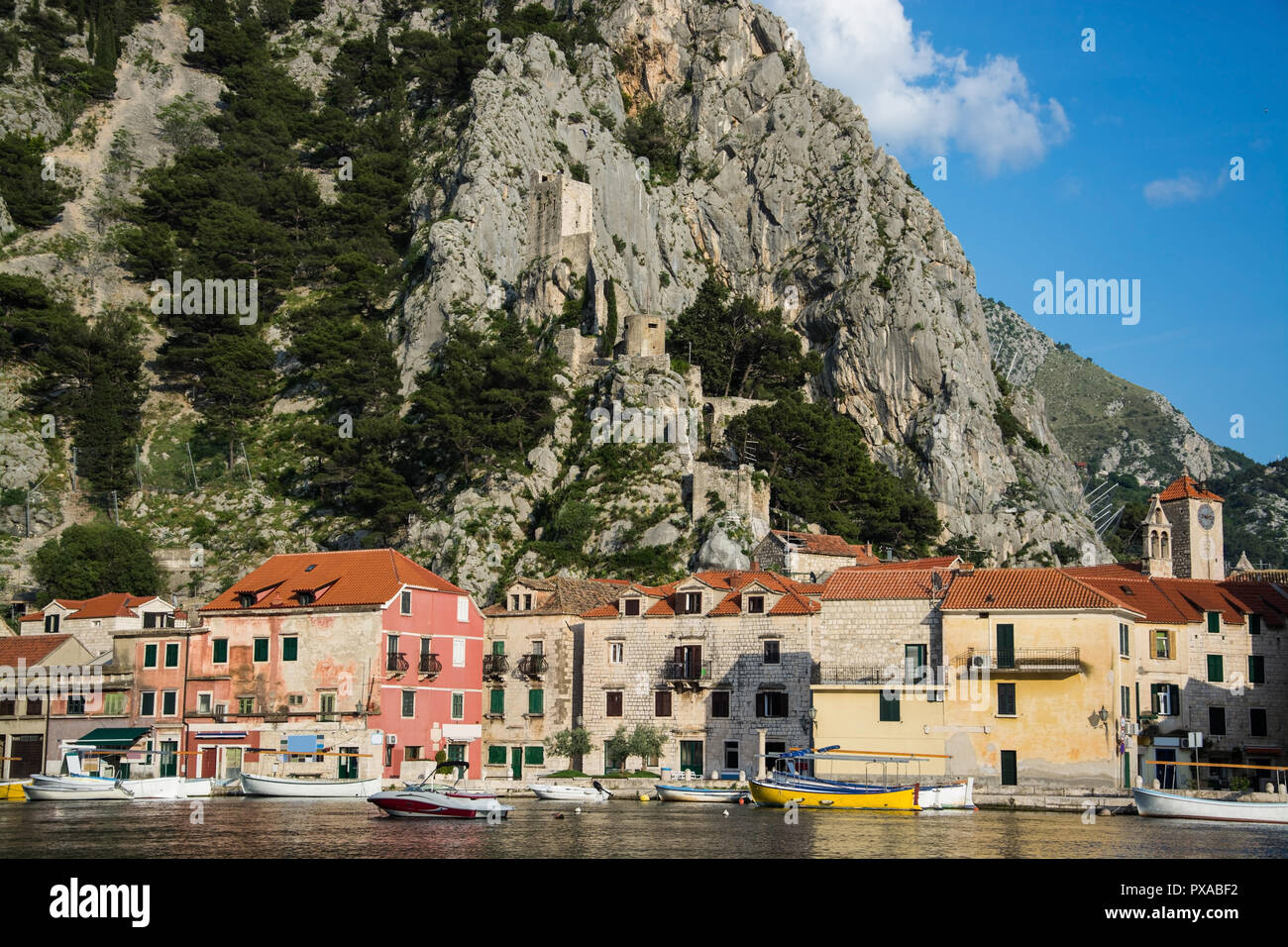 Omis is a town and port in the Dalmatia region of Croatia. Its location is where the Cetina River meets the Adriatic Sea. Stock Photo