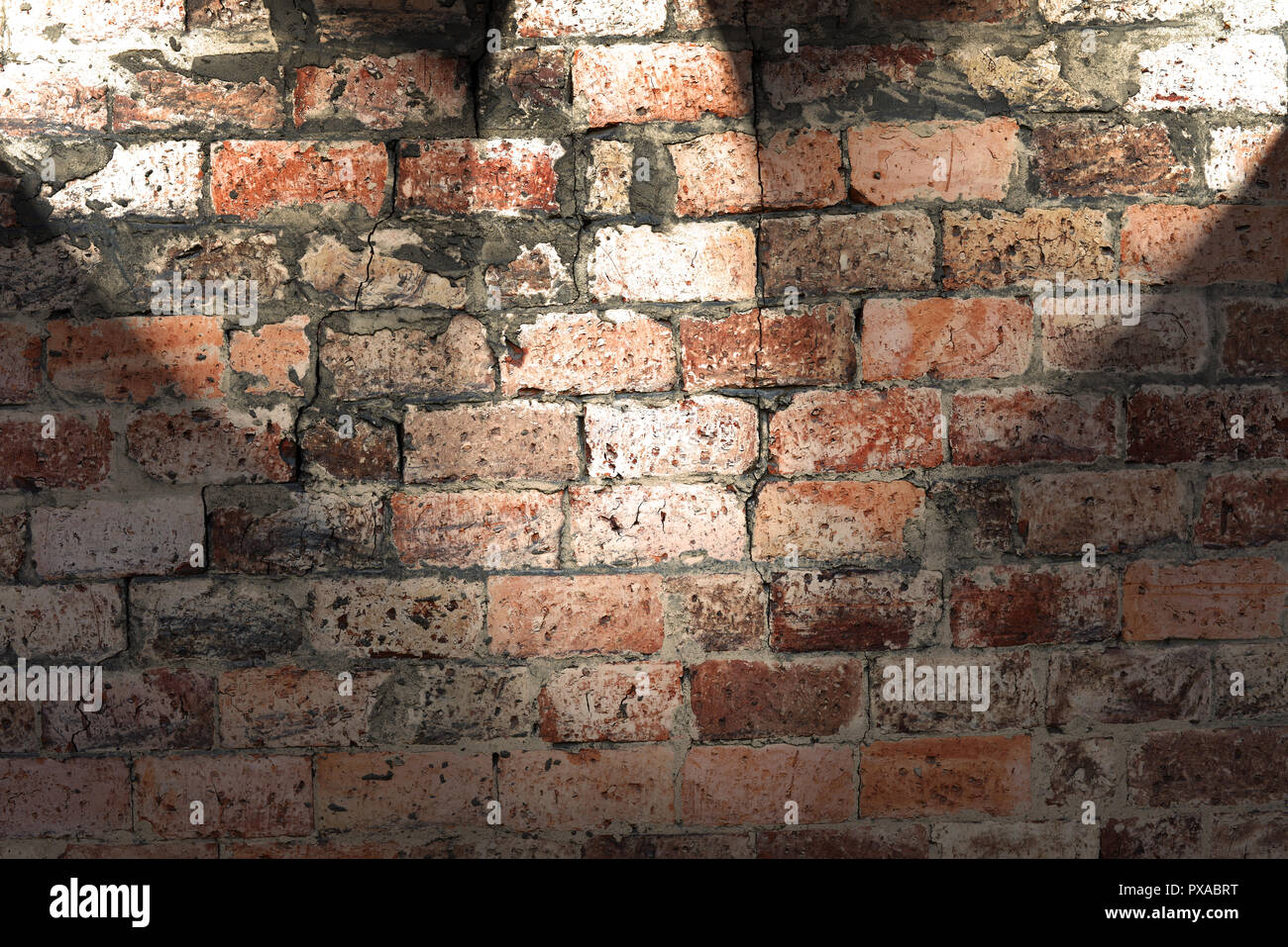 Old brick wall with three spot lights Stock Photo