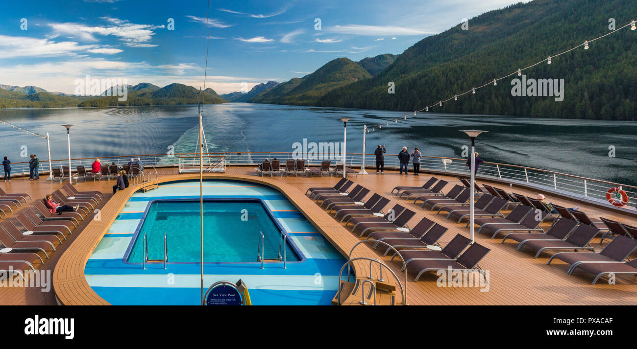 Cruise ship passengers aboard The Volendam, viewing beautiful scenery of the narrow and calm Principe Channel, part of the Inside passage route on the Stock Photo