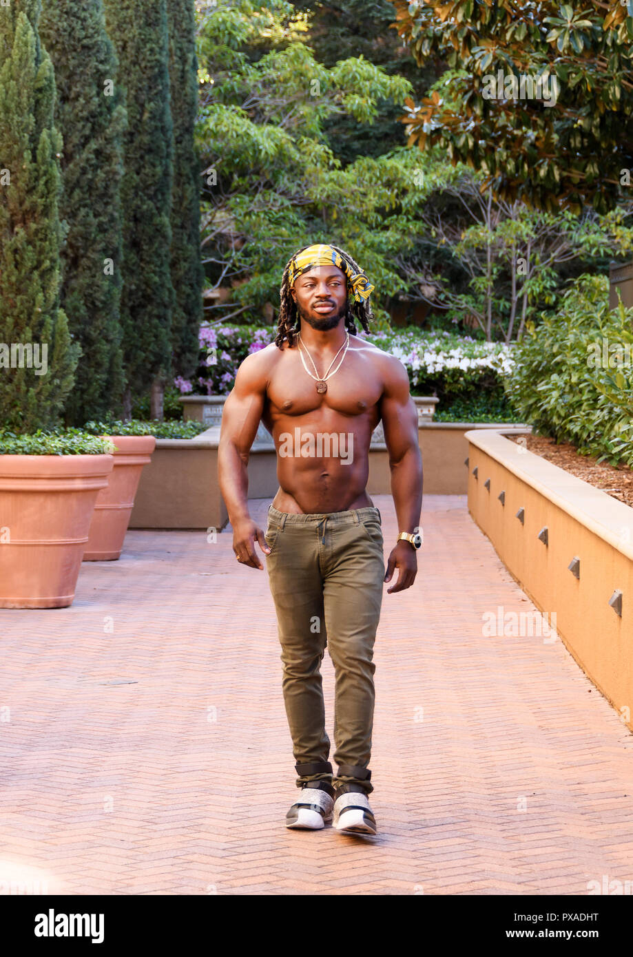 Young handsome shirtless African American man walking Stock Photo Alamy