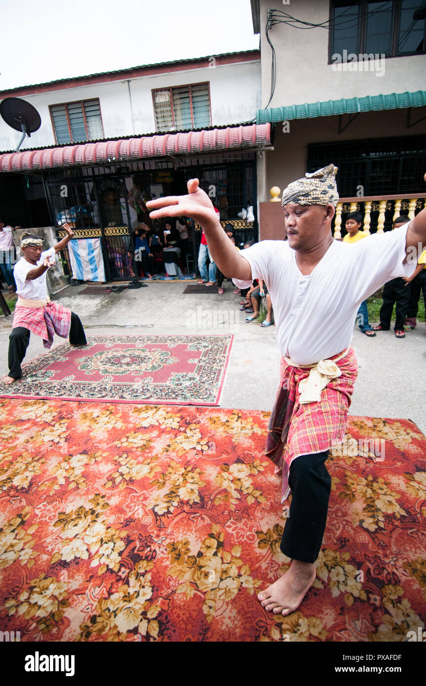 KOTA BHARU, MALAYSIA, JUNE 1 2015: Silat. One of the traditional Malay martial arts performances at a wedding ceremony. Stock Photo