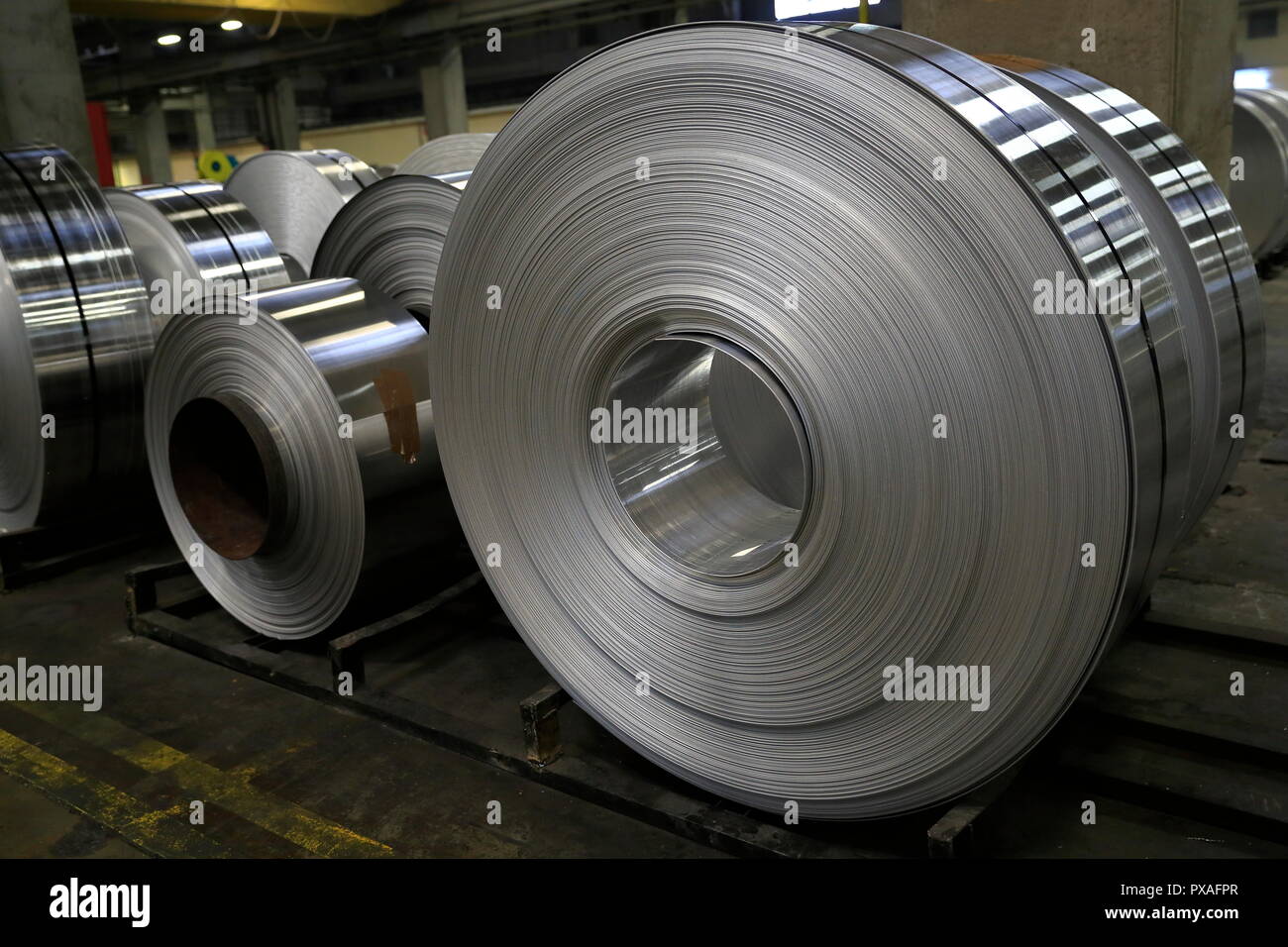 View of finished aluminum sheet rolls in a factory producing semi