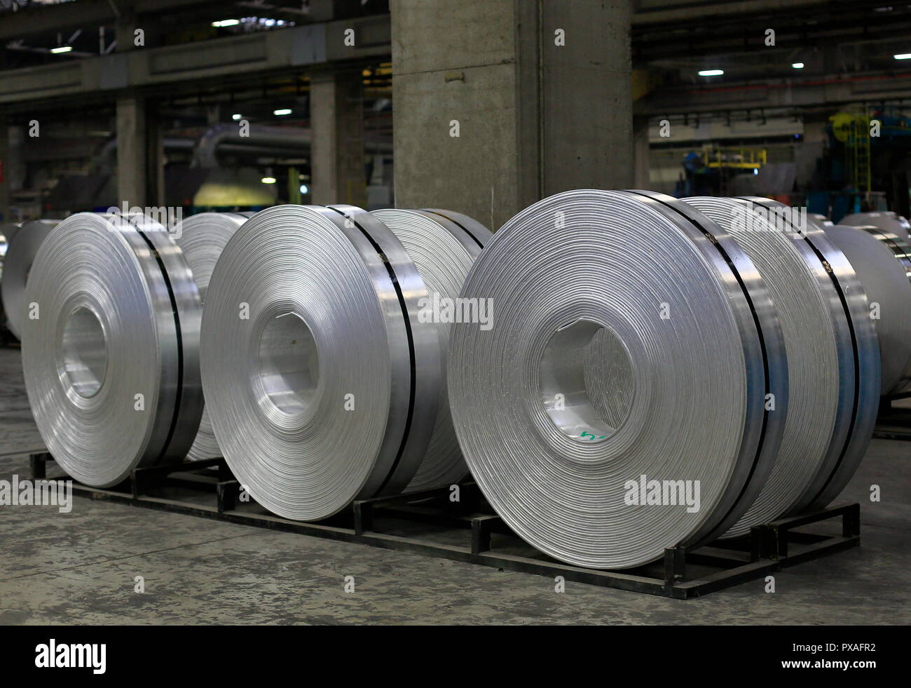 View of finished aluminum sheet rolls in a factory producing semi