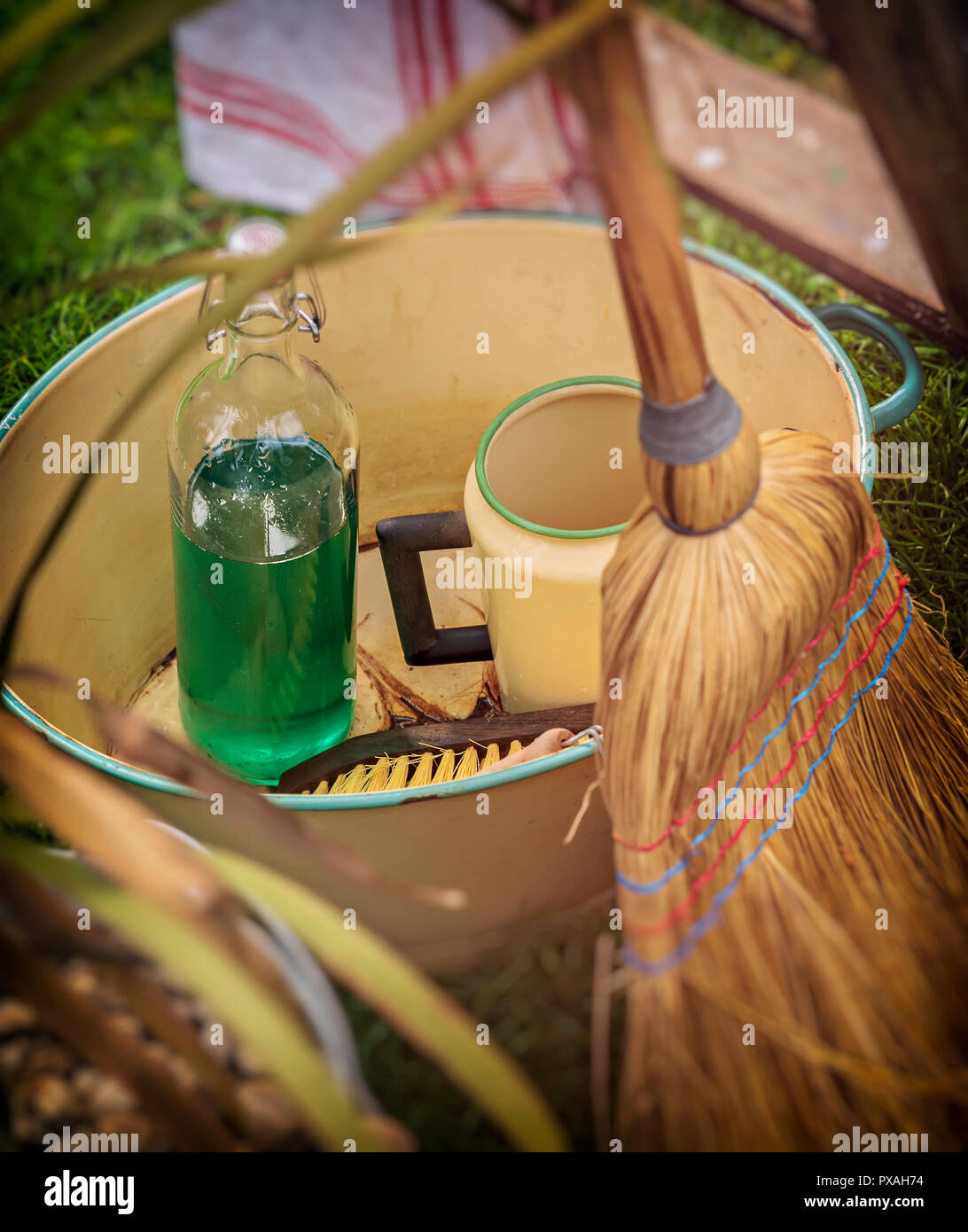 Vintage cleaning utensils in metal basin Stock Photo Alamy