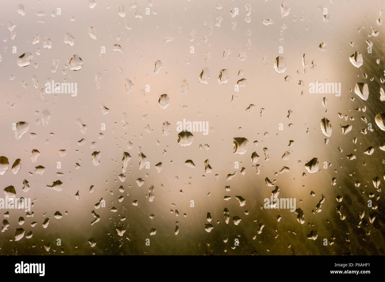 raindrops on window glass on background of cloudy sky Stock Photo - Alamy