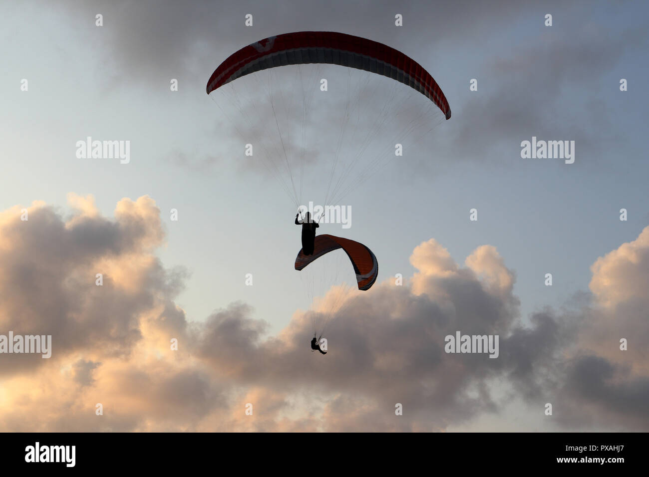 Two para gliders fly high in the sky  over the Baltic sea, in Poland. Stock Photo