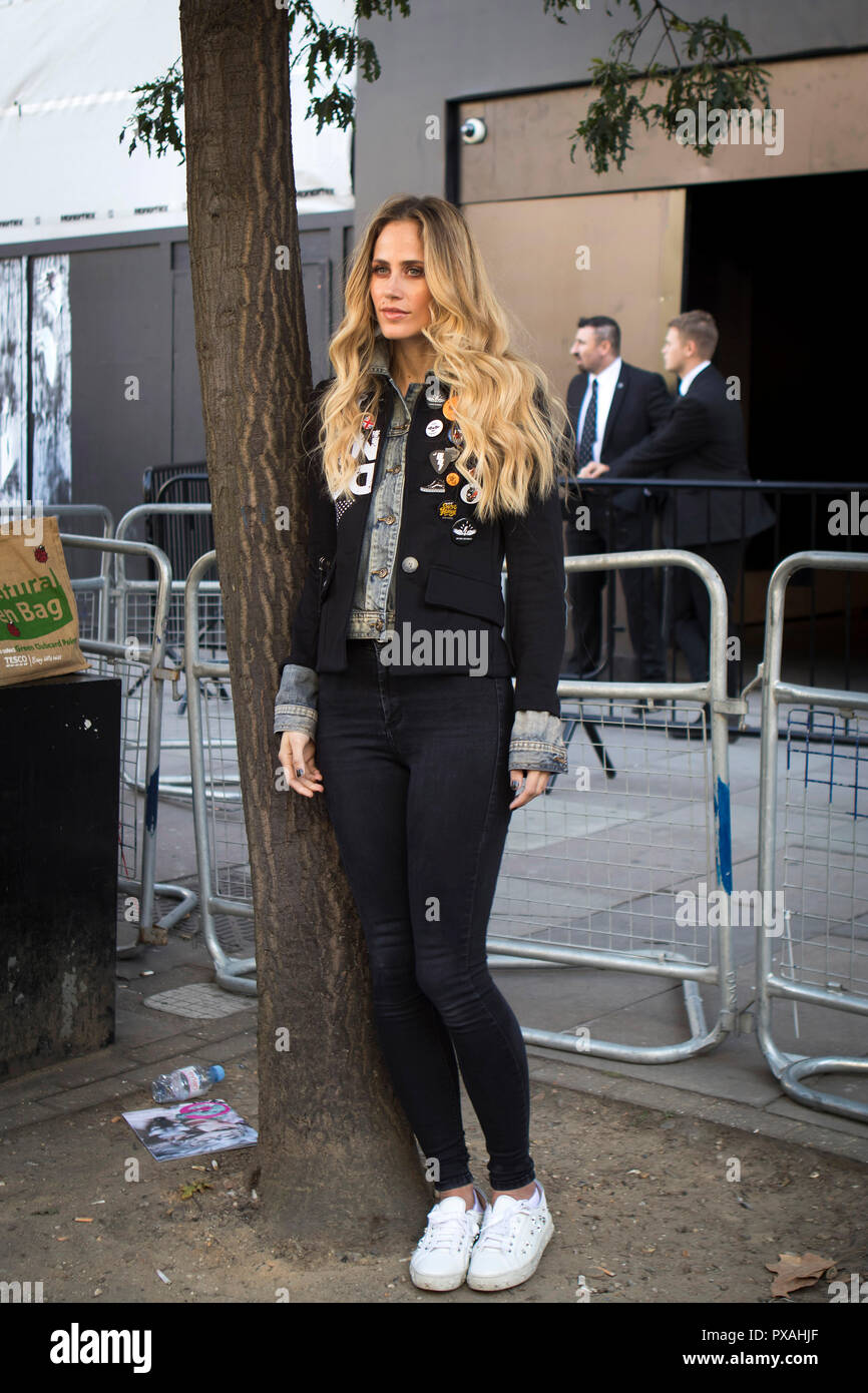 Skinny blonde in black leather trousers 