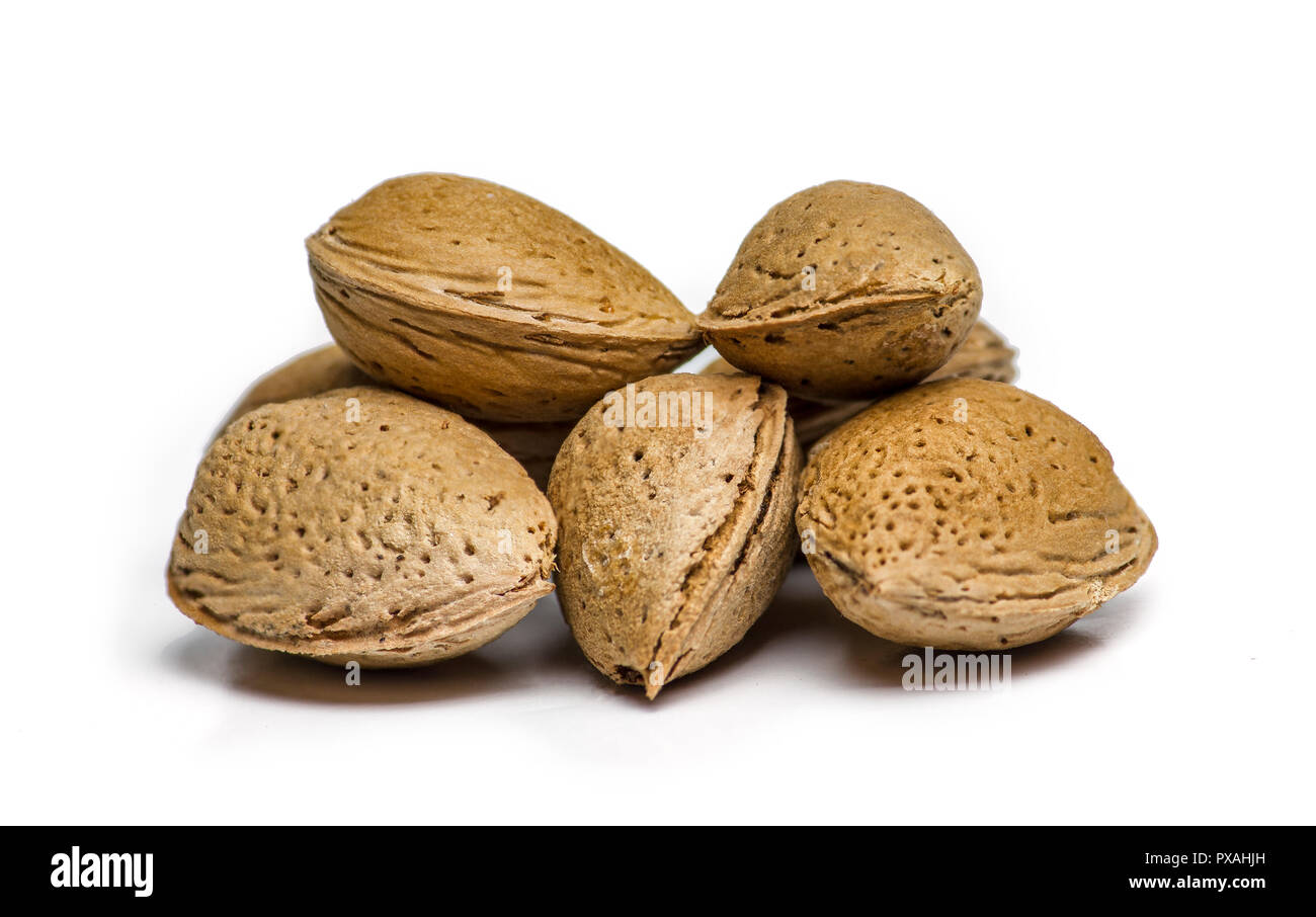 Unpeeled almonds isolated on white background Stock Photo