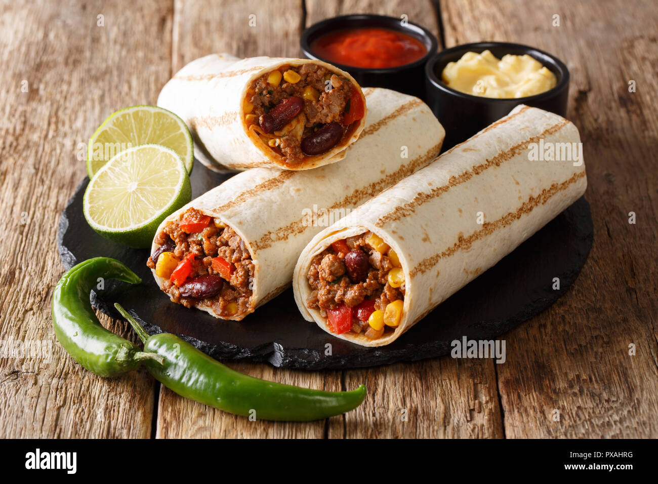 Traditional grilled burritos with beef and vegetables served with