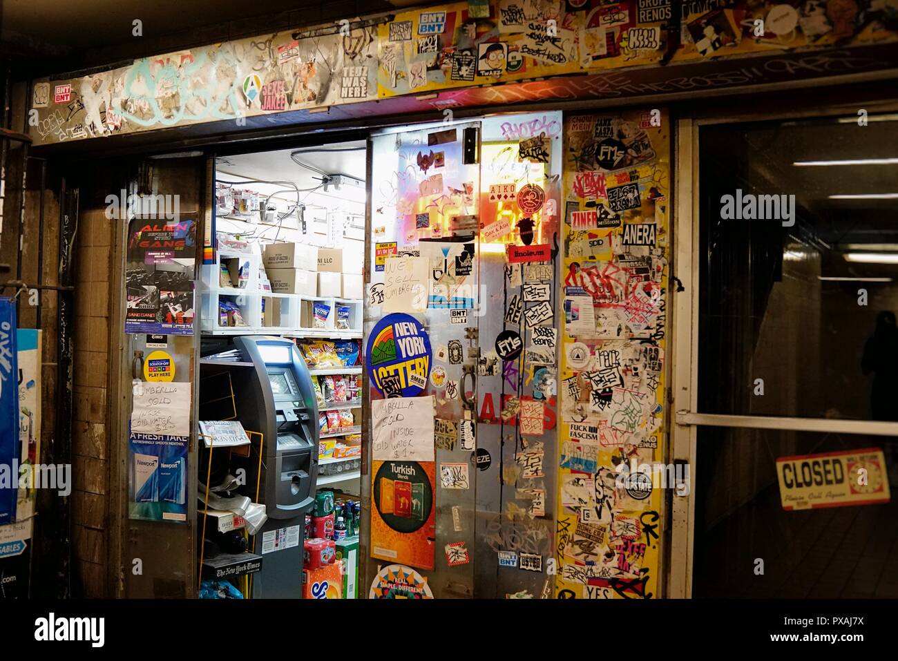 New York, NY; Aug 2018: The outside of an underground NYC bodega covered in stickers Stock Photo