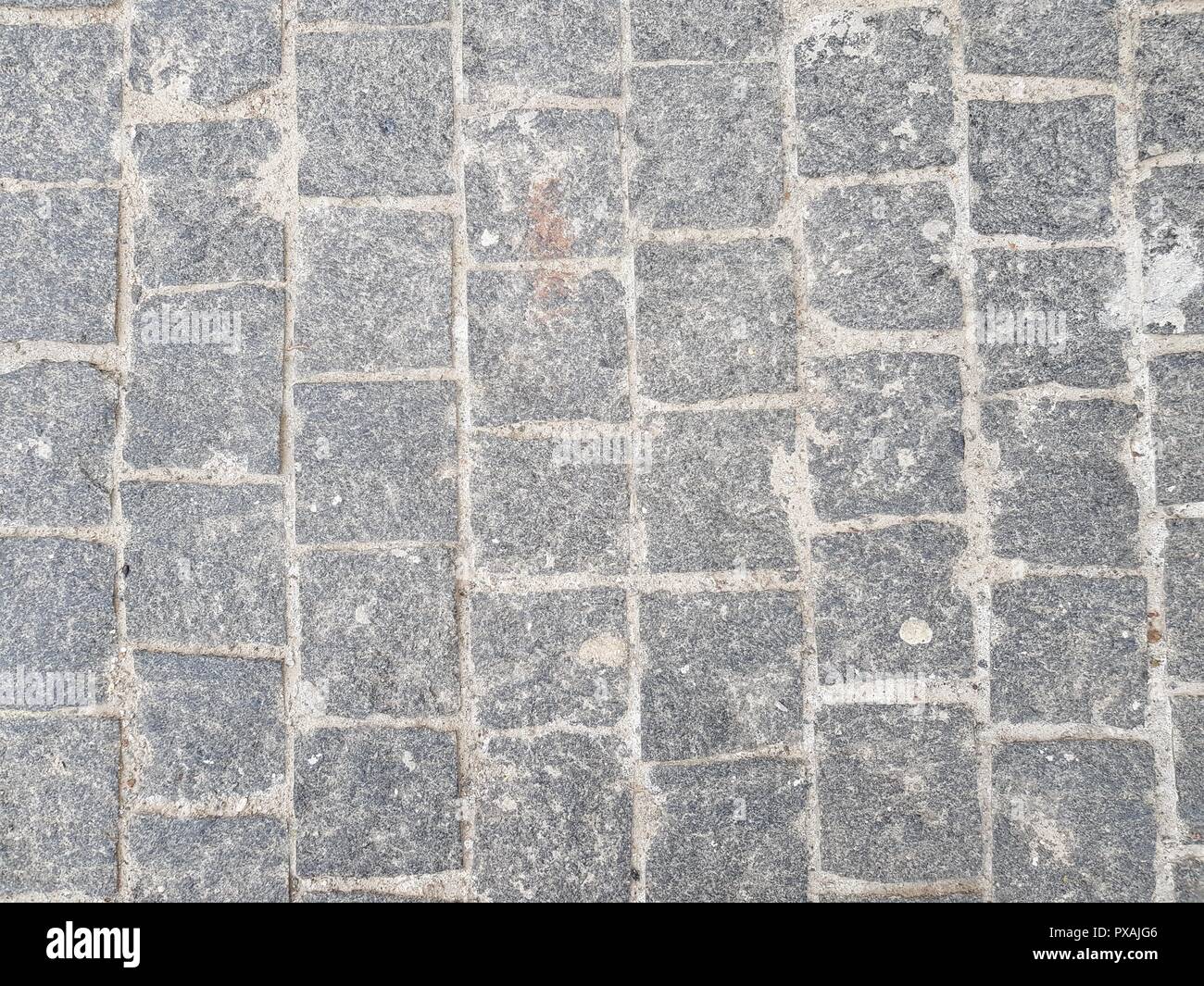 stone paving stone background. stones are laid in straight rows Stock ...