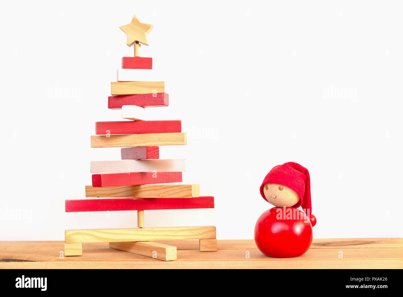 Wooden red and white christmas ornaments on white background Stock Photo