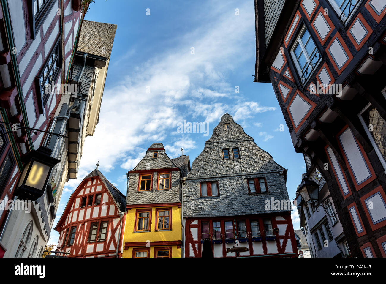 Ancient half-timber houses in Limburg Germany in front of blue sky, low angle view, hdr shot. Stock Photo