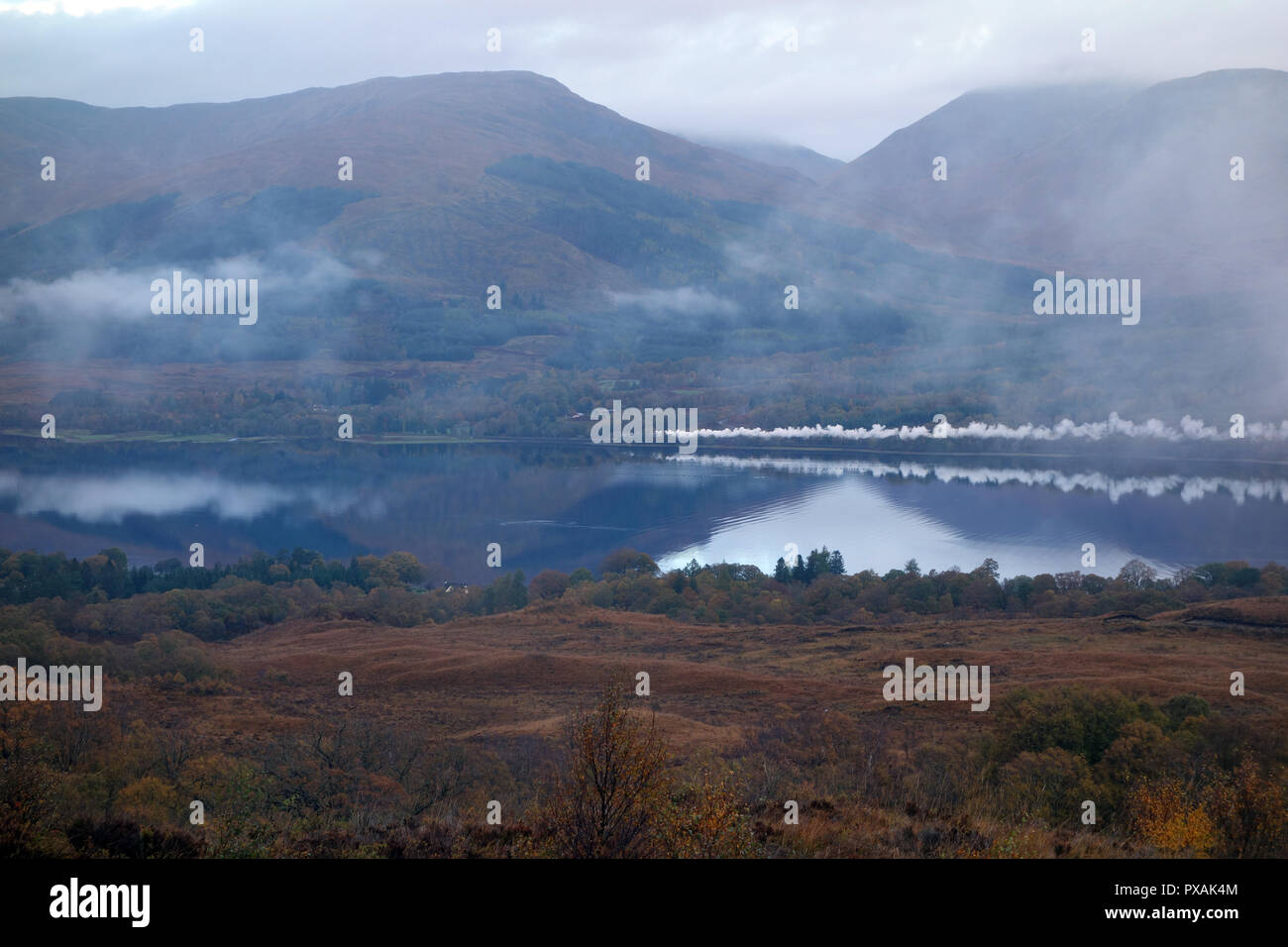 Smoke Reflected in Loch Eil from the (Jacobite Lord of the Isles) Steam Train on route to the Scottish Mountain Corbett Stob Coire a' Chearcaill Stock Photo