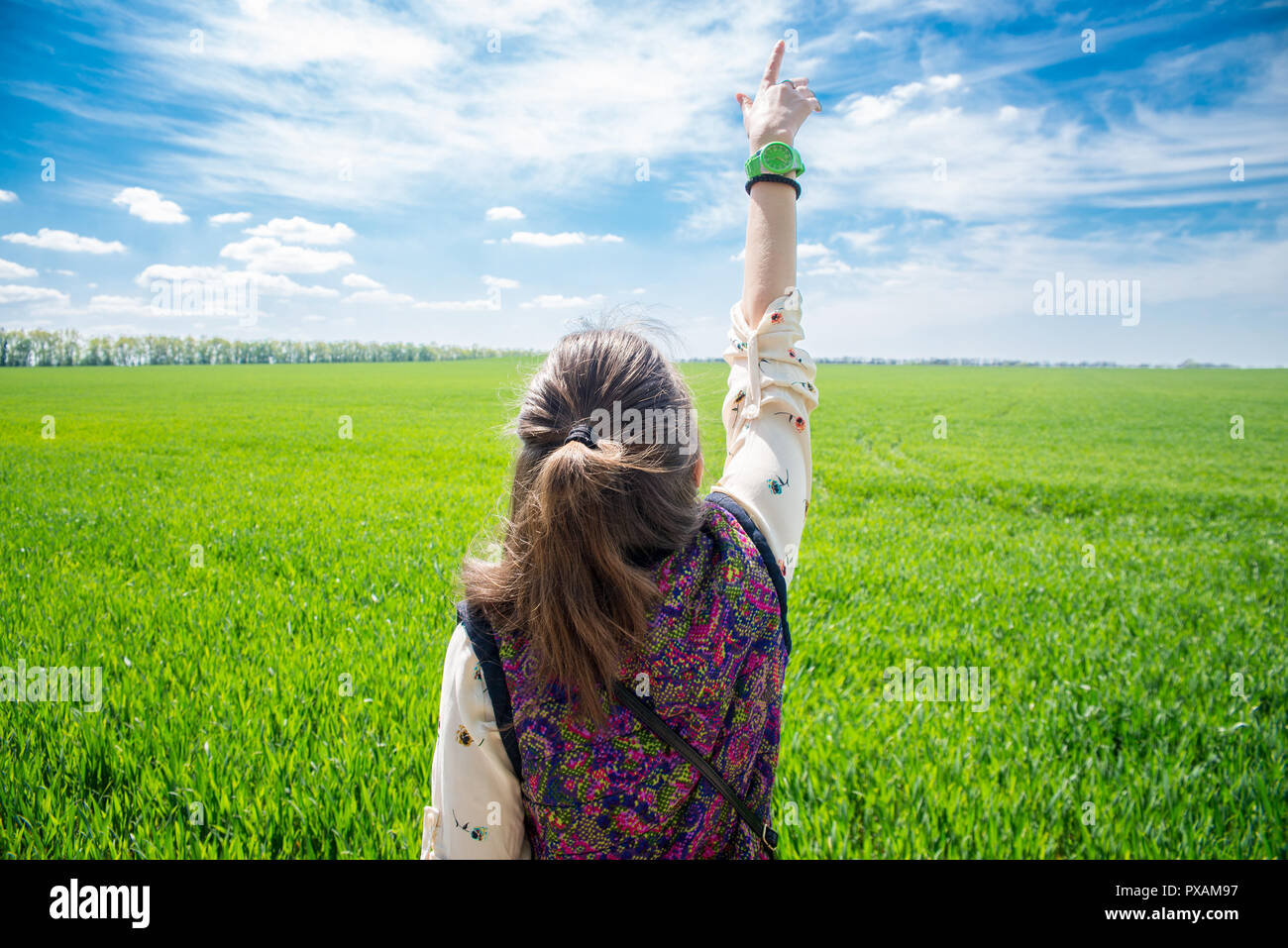 Woman standing on vibrant green hi-res stock photography and images - Alamy