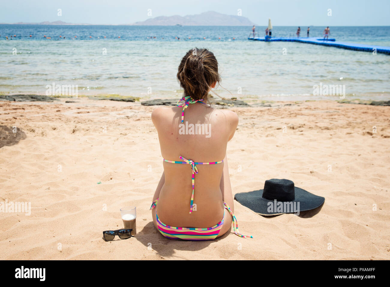 woman in a swimsuit on the beach  Stock Photo