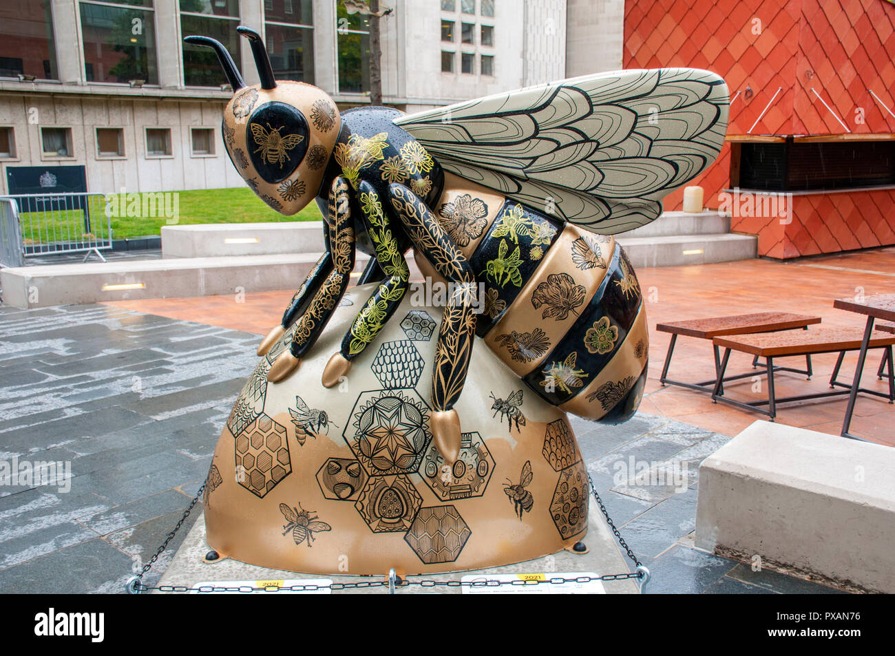 A Worker Bee's Work is never Done, by Laura-Kate Chapman.  One of the Bee in the City sculptures, Spinningfields, Manchester, UK. Stock Photo