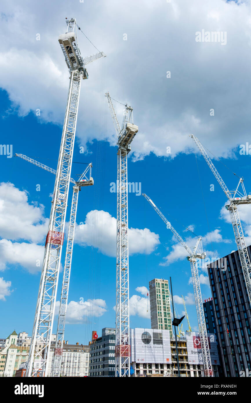 Tower cranes at the Circle Square office and residential development, Oxford Road, Manchester, England, UK Stock Photo