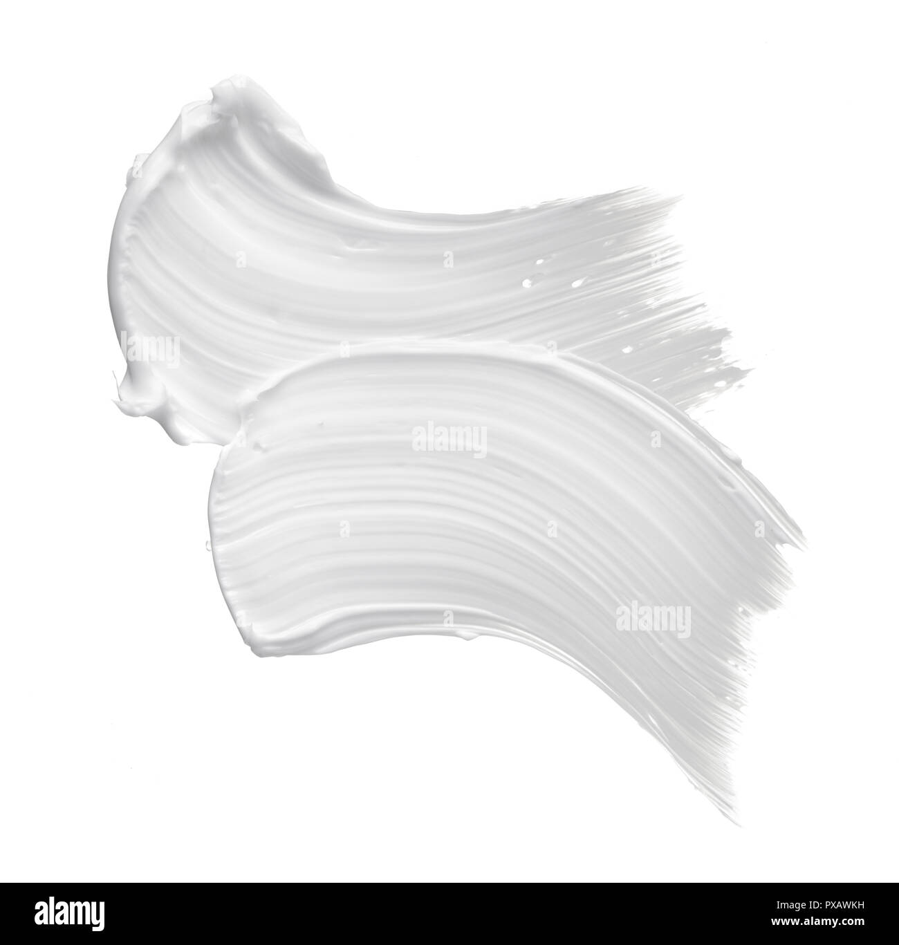 White smear of cosmetic cream or white acrylic paint isolated on white