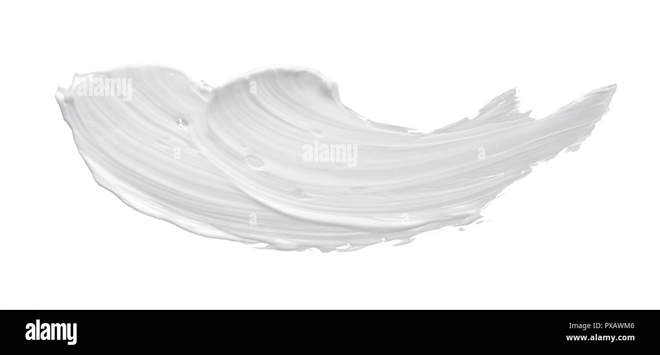 White smear of cosmetic cream or white acrylic paint isolated on white