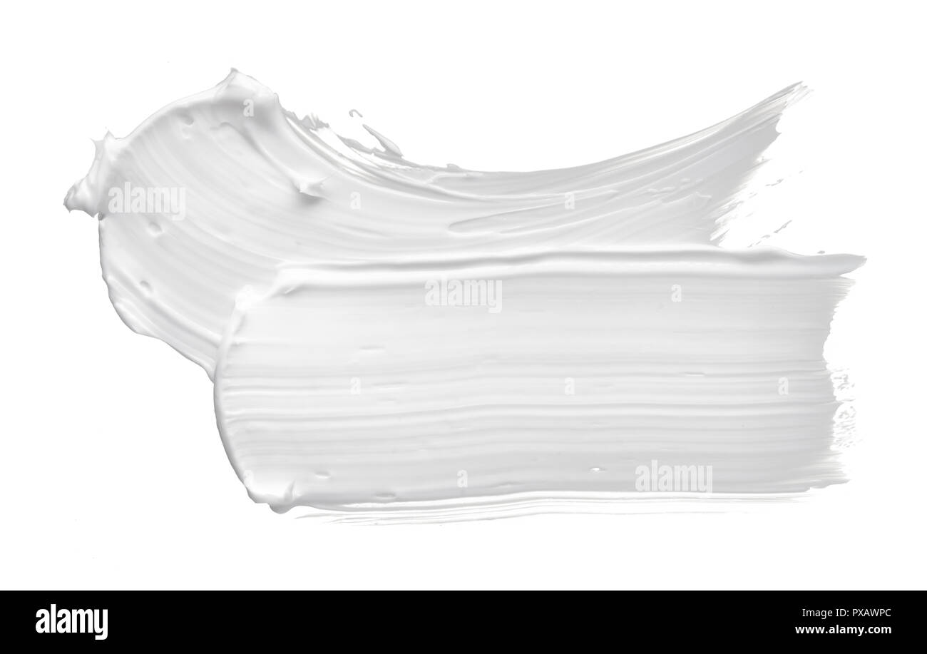 White smear of cosmetic cream or white acrylic paint isolated on white