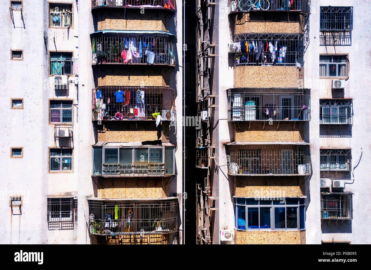 A zoomed in picture of apartment buildingsand hanging laundry in luohu district in the city of Shenzhen China. Stock Photo