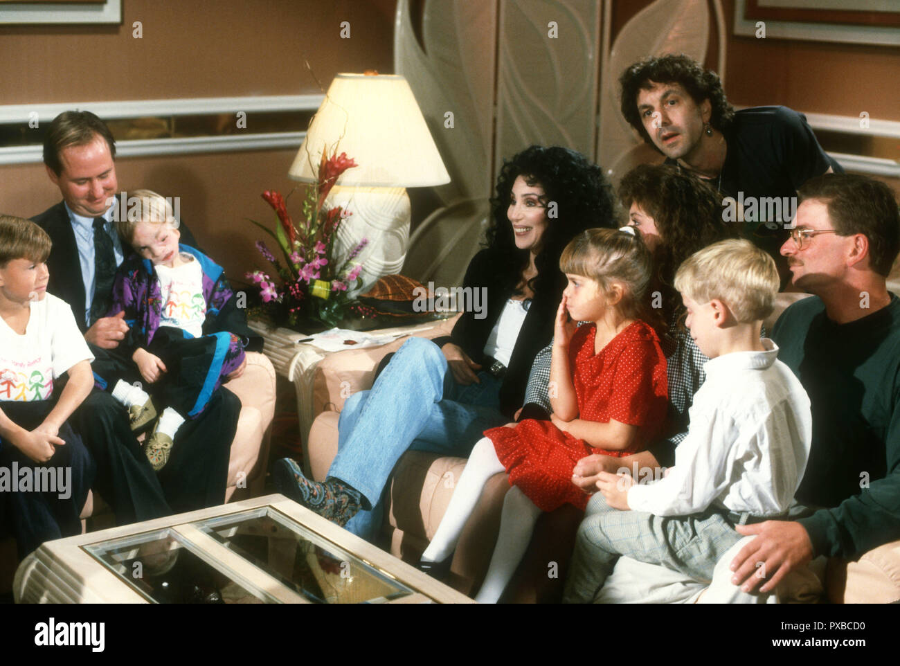 NEW YORK, NY - OCTOBER 23: (EXCLUSIVE) Talk Show Host Maury Povich and  singer/actress Cher filming the Maury Povich Show with Cranial Facial Kids  on October 23, 1992 in New York, New