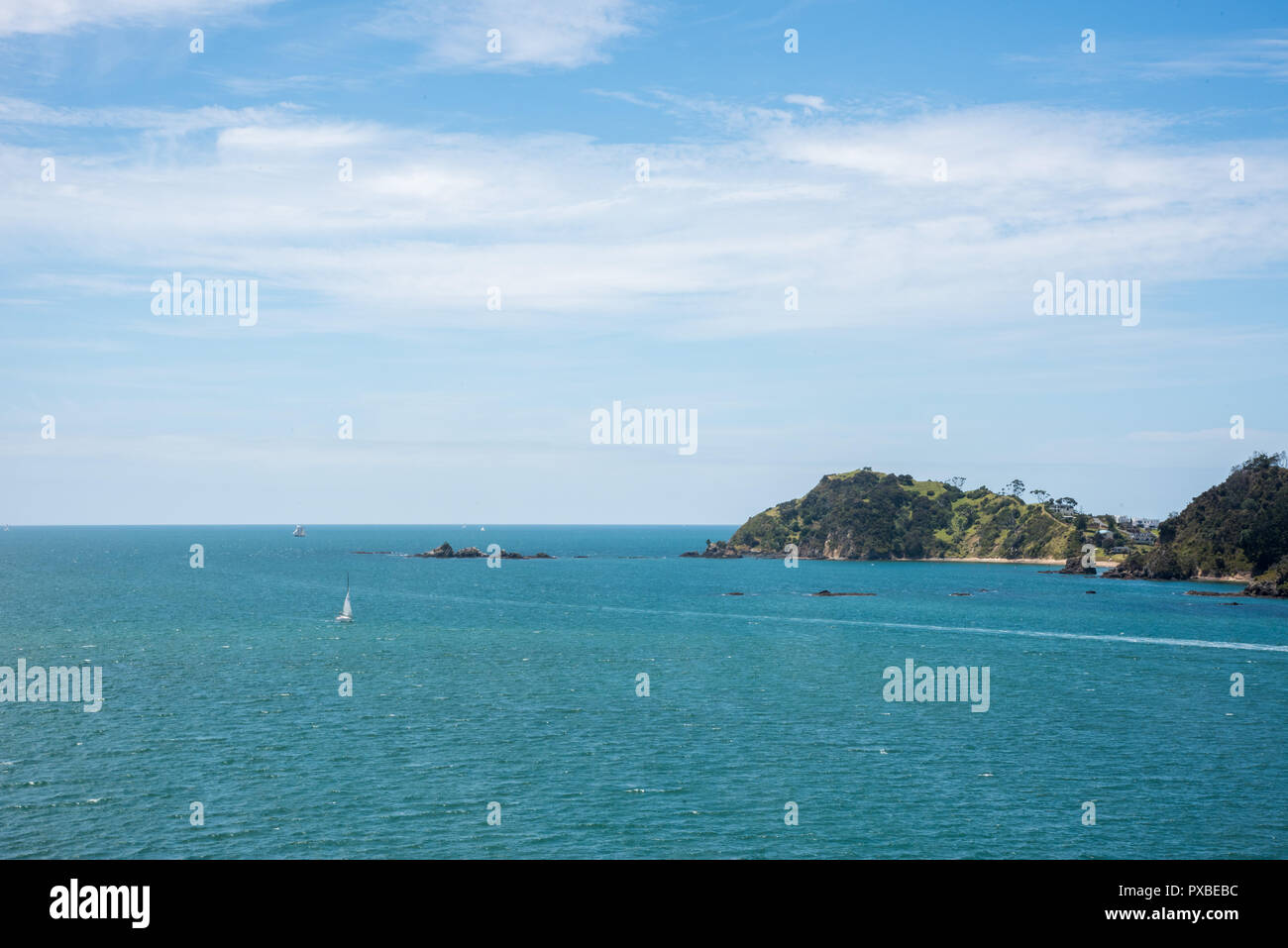 Bay of Islands, North Island, New Zealand-December 18,2016: Sailing along the coast in the turquoise Tasman Sea in the Bay of Islands, New Zealand Stock Photo