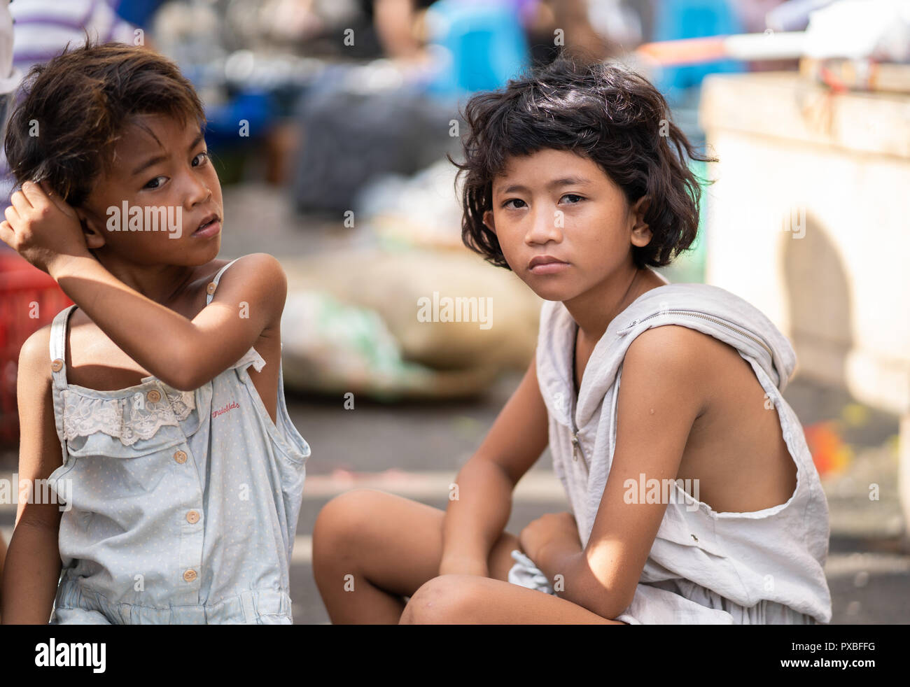 Environmental portrait of two young Filipino girls within the carbon margket,Cebu City,Philippines Stock Photo
