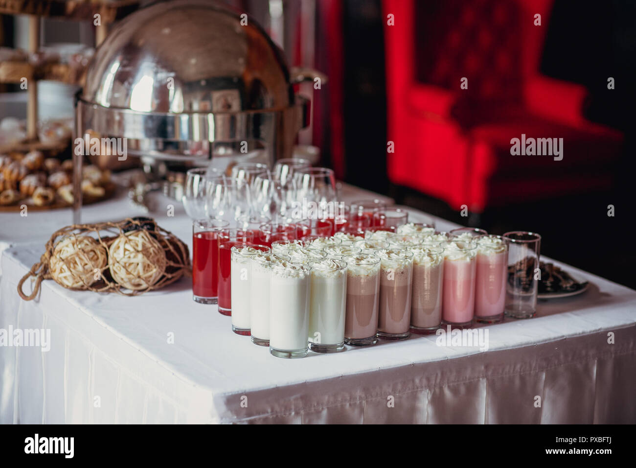 Candy bar on birthday party with a lot of different candies, cupcakes, souffle and cakes
