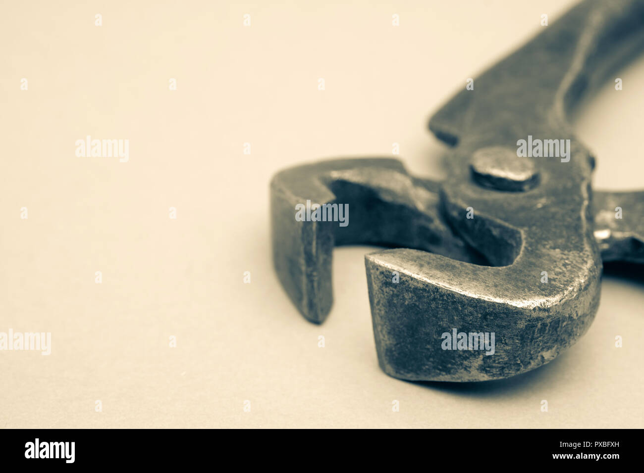 Tools for pulling nails - old metal pliers. Stock Photo