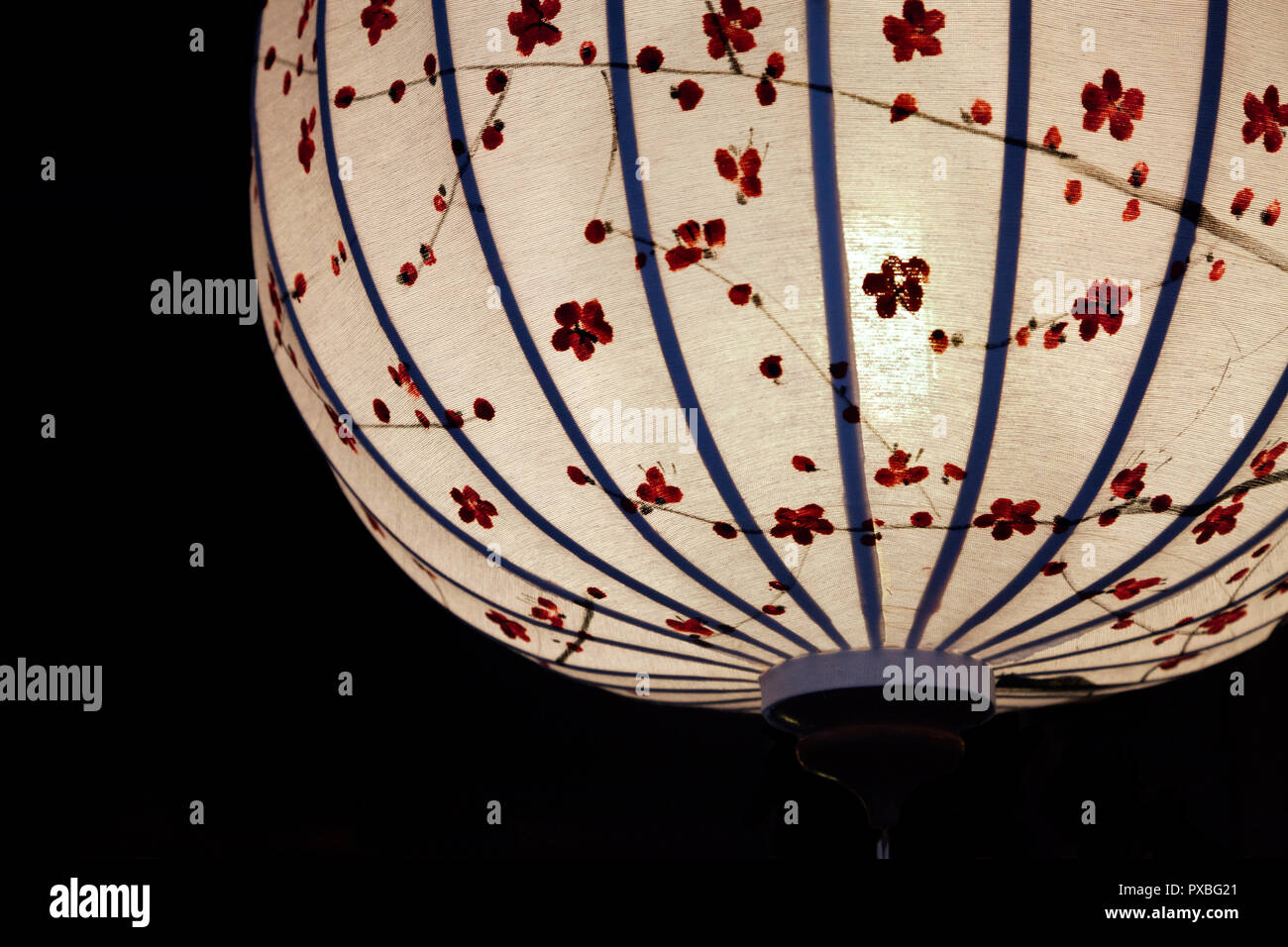 Close-up of white Chinese lantern over black background Stock Photo - Alamy