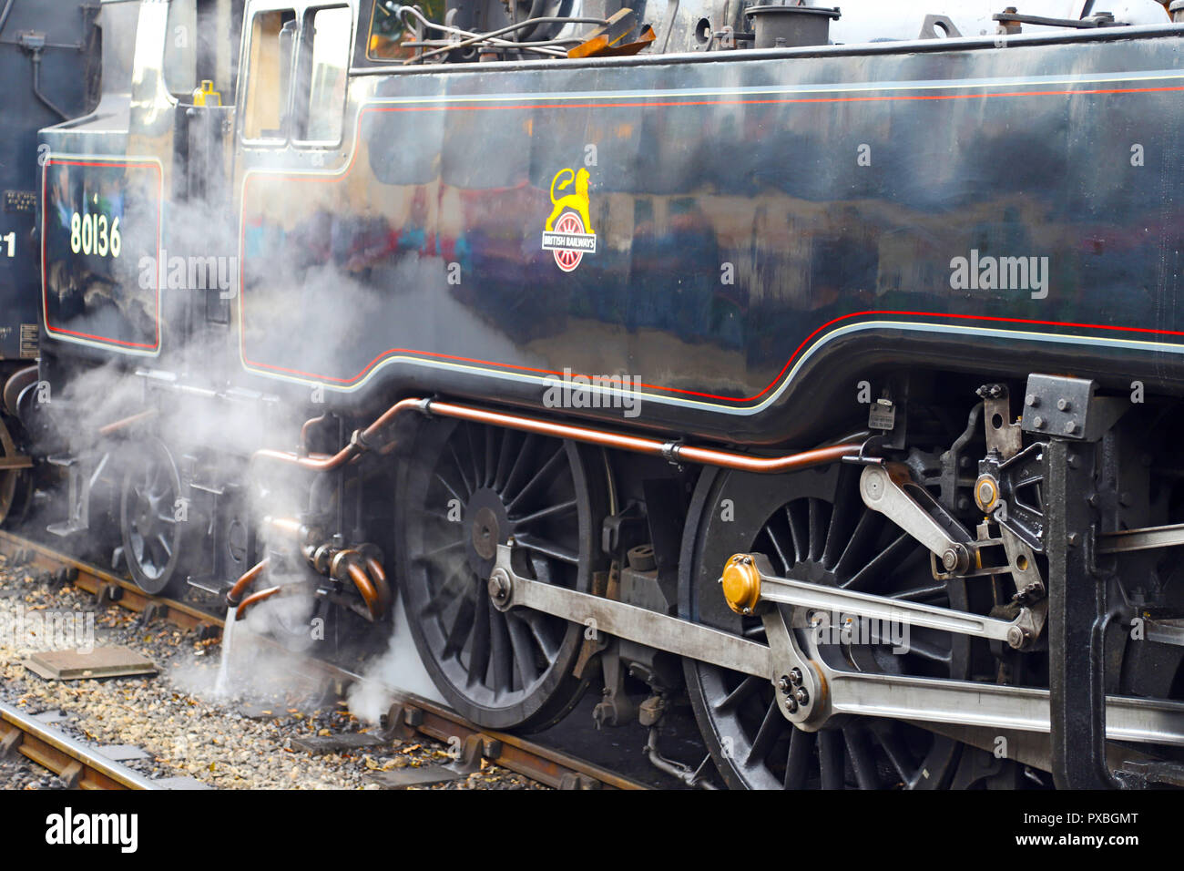 Close-up of coupling gear and driving wheels of 2-6-4T Class Standard 4   No.80136, awaiting departure of its passenger service at Pickering Station. Stock Photo