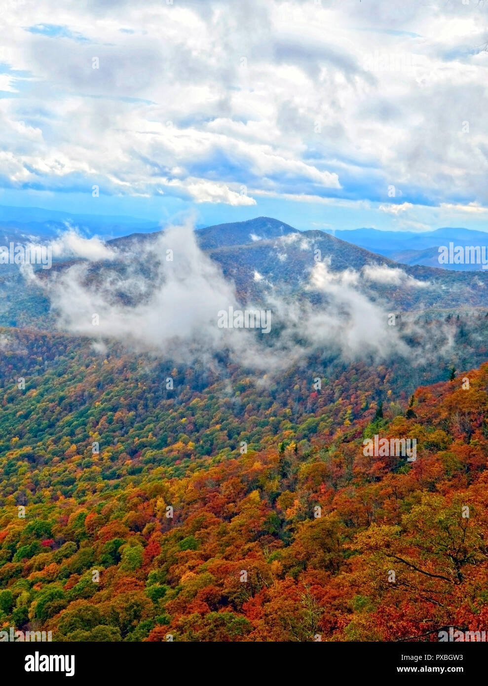 Clouds over the mountain tops Stock Photo