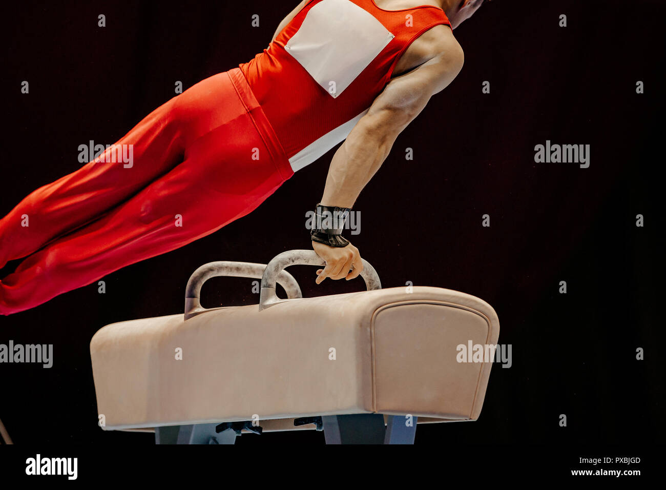 gymnast exercise pommel horse in competition artistic gymnastics Stock