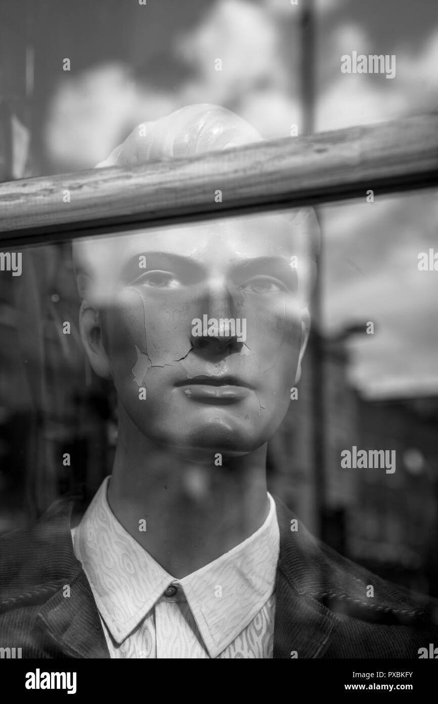 Mannequin and reflections in a window of a vintage clothes shop, Brick lane, London. Stock Photo