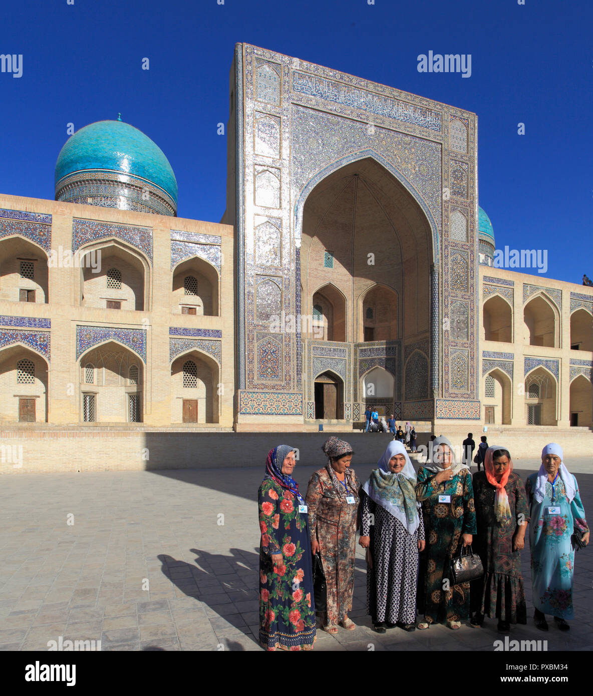 Uzbekistan; Bukhara; Mir-i-Arab Madrasa, islamic school, Uzbek women, Stock Photo
