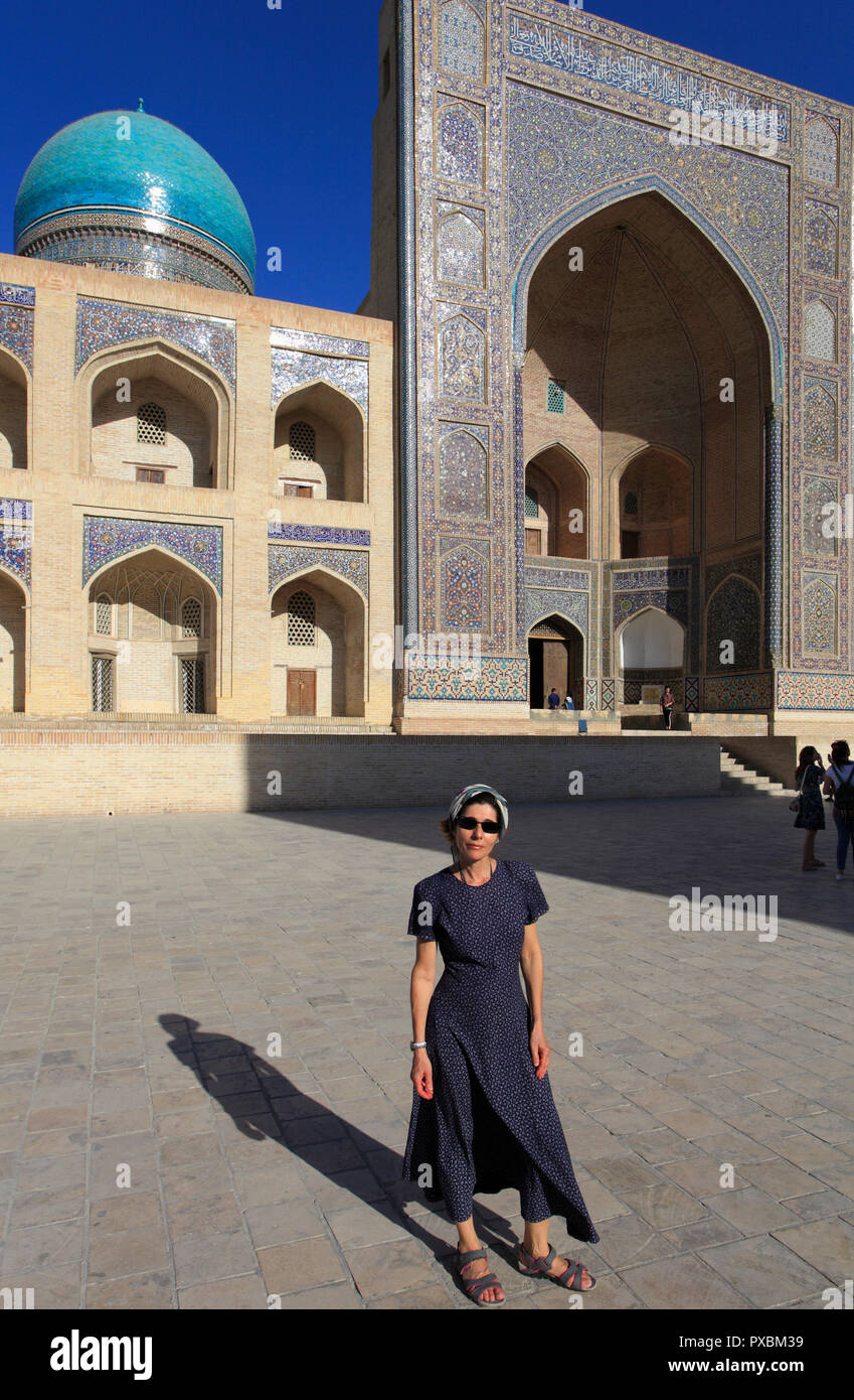 Uzbekistan; Bukhara; Mir-i-Arab Madrasa, islamic school, western tourist, Stock Photo