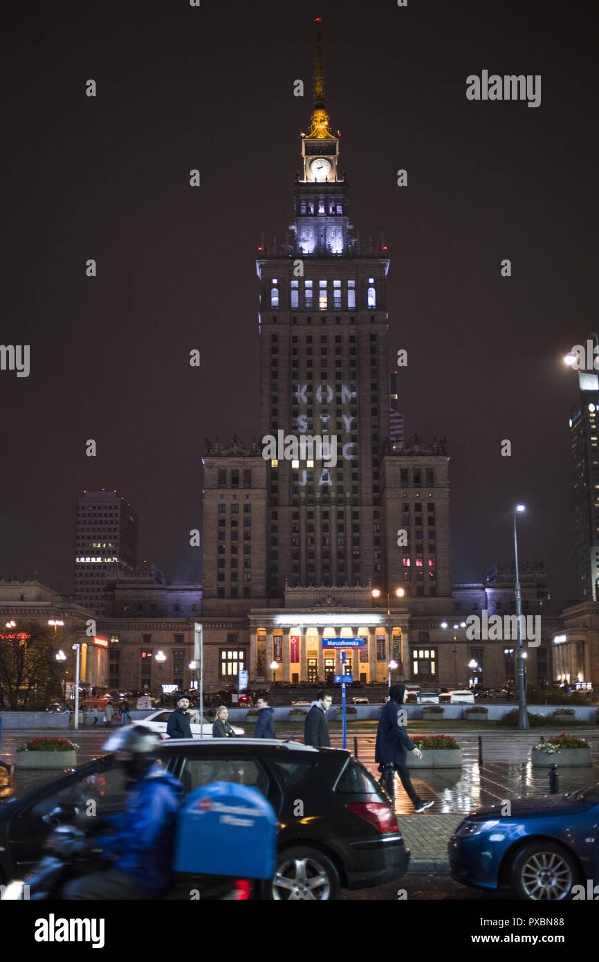 Warsaw, Mazowieckie, Poland. 20th Oct, 2018. The Constitution word seen displayed by the street opposition activists on the Palace of Culture and Science in Warsaw.A day before the local governments election in Poland, the street opposition activists displayed the Konstytucja (Constitution) graphics at the most iconic building of Warsaw - the Palace of Culture and Science. The graphic would be visible at least for two weeks.This happened a day after the Court of Justice of the European Union ordered Poland to halt contested supreme court appointments, which arose from a complaint by the Stock Photo