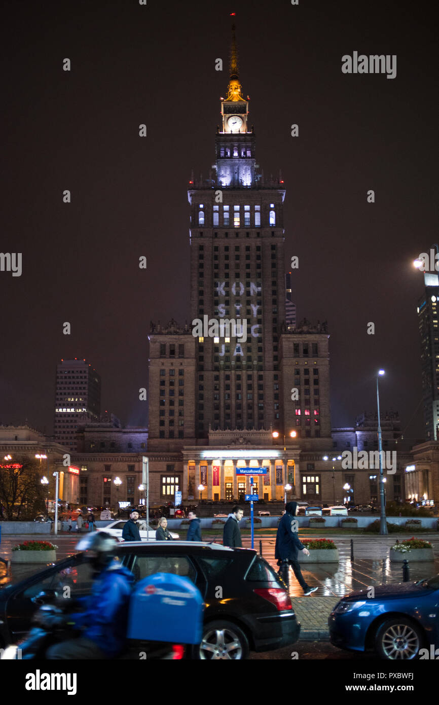 The word Constitution seen displayed by the street opposition activists on the Palace of Culture and Science in Warsaw a day before the local government elections in Poland. Opposition activists displayed the word Konstytucja (Constitution) on most iconic building of Warsaw - the Palace of Culture and Science. The graphic would be visible at least for two weeks. This happened a day after the Court of Justice of the European Union ordered Poland to halt contested supreme court appointments, which arose from a complaint by the European Commission that reforms of the Polish court system reduce ju Stock Photo