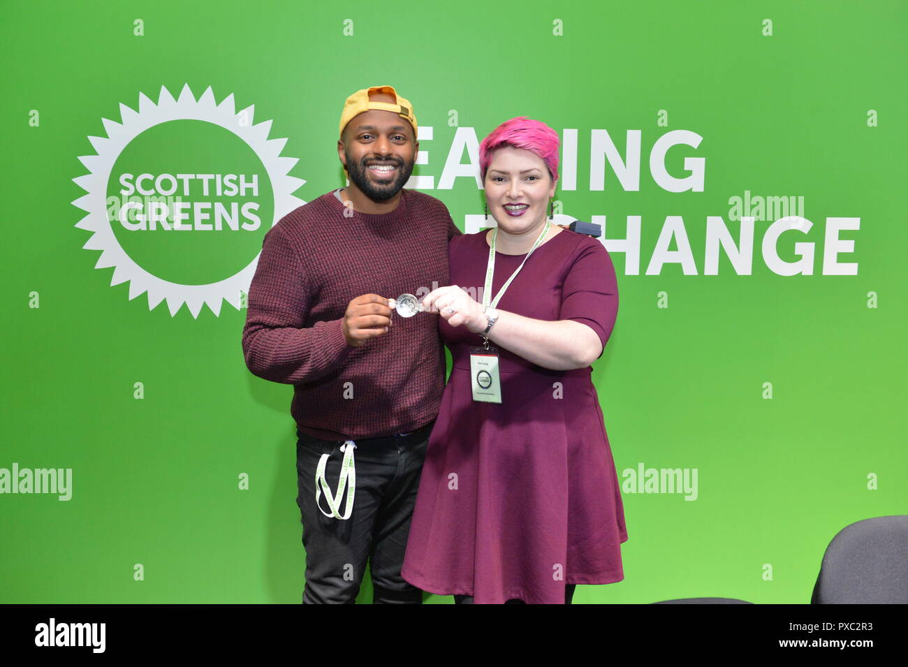 Glasgow, UK. 21st Oct 2018. Leading The Change. Scottish Green Party National Conference. Pictured (left) Magid Magid - Lord Mayor of Sheffield being presented with a silver quaich by (right) Kim Long - Councillor for Dennstoun, Glasgow. Credit: Colin Fisher/Alamy Live News Stock Photo
