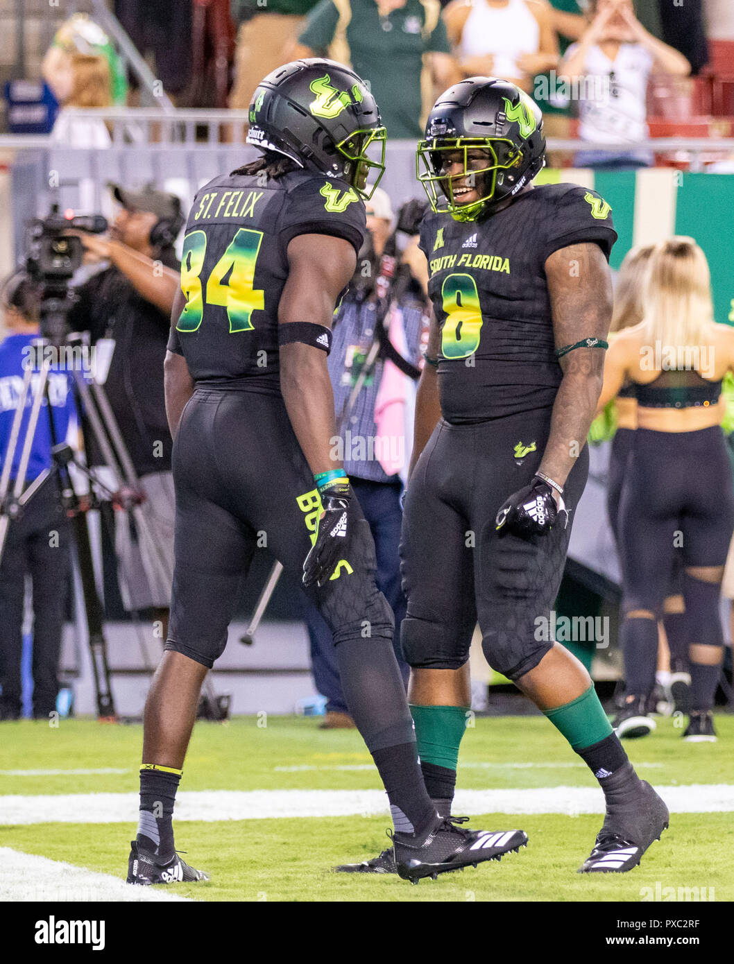 Tampa, Florida, USA. 20th Oct, 2018. South Florida Bulls wide receiver Tyre McCants (8) congratulates South Florida Bulls wide receiver Randall St. Felix (84) after Randall makes the catch and runs in for a touchdown on the opening play of the 2nd half during the game between the UConn Huskies and the South Florida Bulls at Raymond James Stadium in Tampa, Florida. Del Mecum/CSM/Alamy Live News Stock Photo