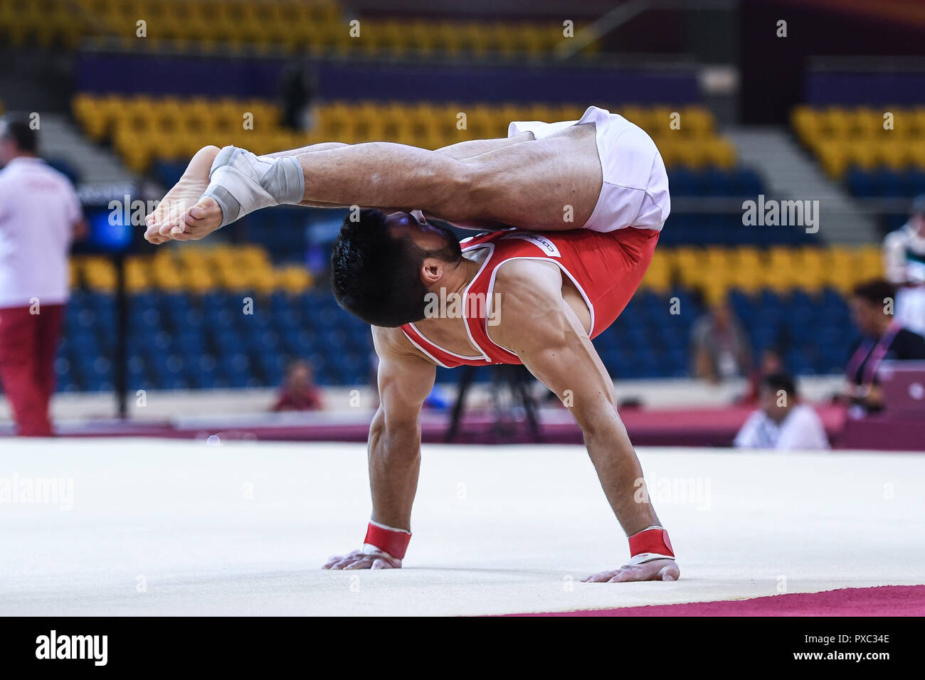 Doha, Qatar. 21st Oct, 2018. OLIVER HEGI from Switzerland practices on the floor exercise during the first day of podium training before the competition held at the Aspire Dome in Doha, Qatar. Credit: Amy Sanderson/ZUMA Wire/Alamy Live News Stock Photo