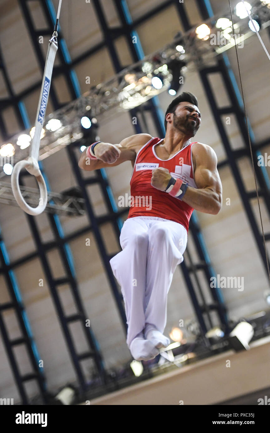 Doha, Qatar. 21st Oct, 2018. OLIVER HEGI from Switzerland practices on the still rings during the first day of podium training before the competition held at the Aspire Dome in Doha, Qatar. Credit: Amy Sanderson/ZUMA Wire/Alamy Live News Stock Photo