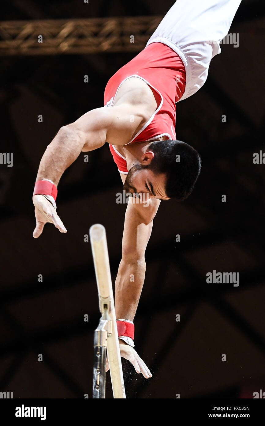 Doha, Qatar. 21st Oct, 2018. OLIVER HEGI from Switzerland practices on the parallel bars during the first day of podium training before the competition held at the Aspire Dome in Doha, Qatar. Credit: Amy Sanderson/ZUMA Wire/Alamy Live News Stock Photo