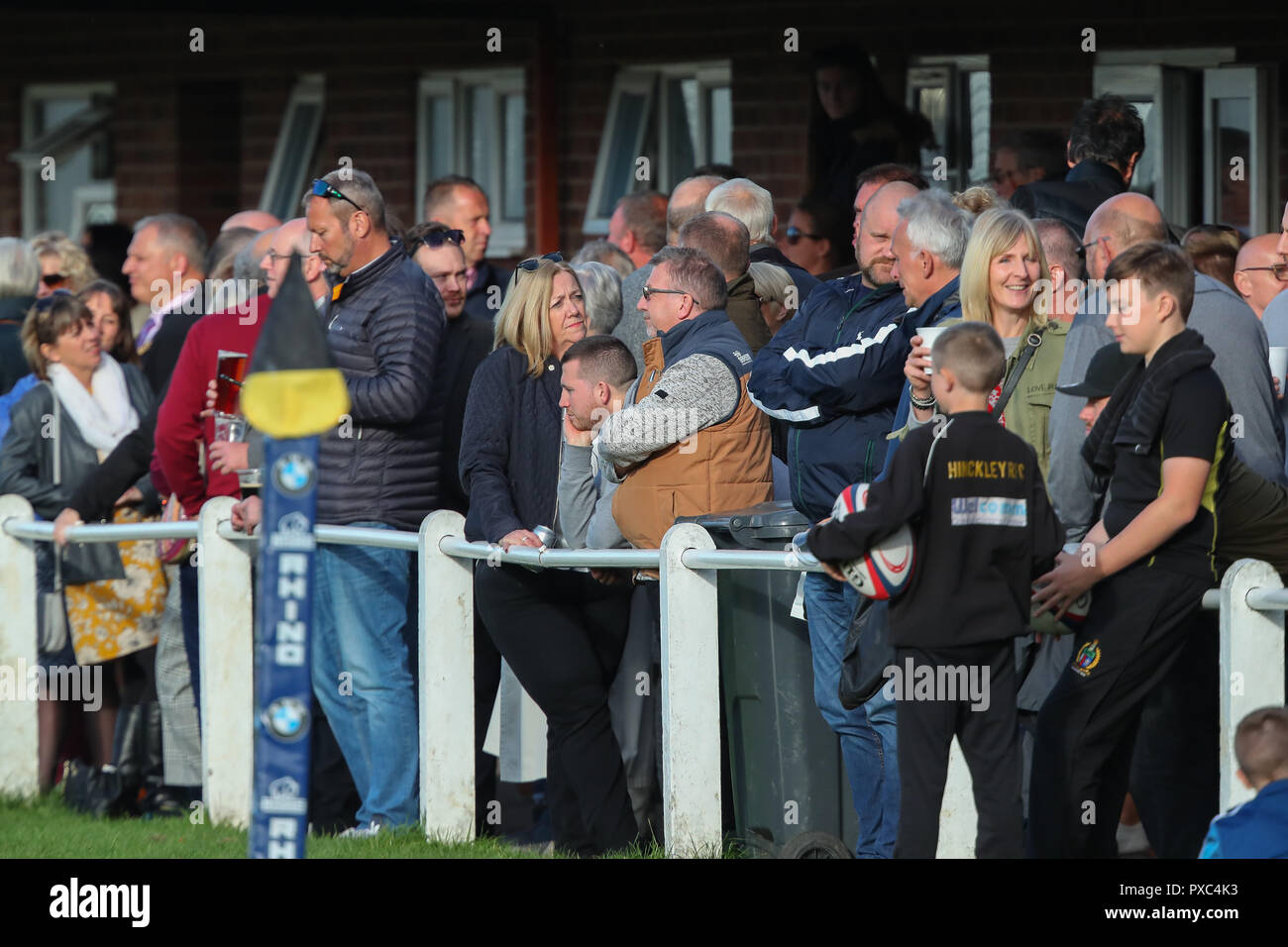 20.10.2018 Hinckley, Leicester, England. Rugby Union, Hinckley rfc v Fylde rfc.  Spectators watch the game outside the main stand during the RFU National League 2 North (NL2N) game played at the Leicester  Road Stadium.    © Phil Hutchinson / Alamy Live News Stock Photo